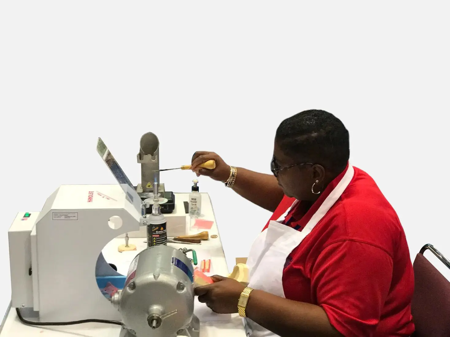 7.jpg (1) A woman in red shirt working on a machine.